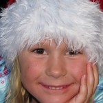 Santa Hannah delivering her christmas stockings to the guests