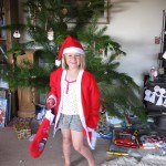Santa Hannah delivering her stockings to the guests